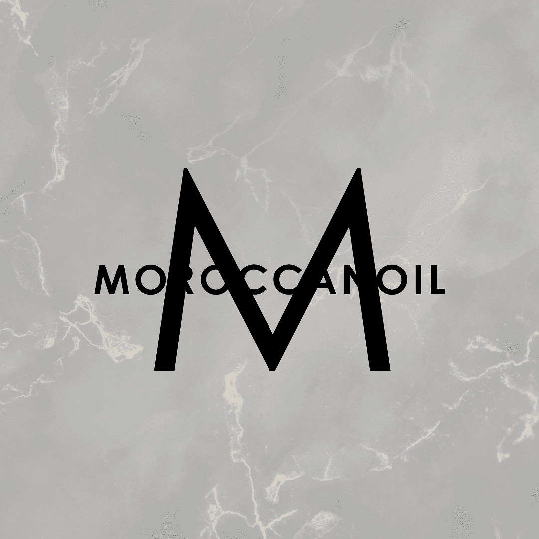 Moroccanoil logo with large 'M' on a textured gray marble background.